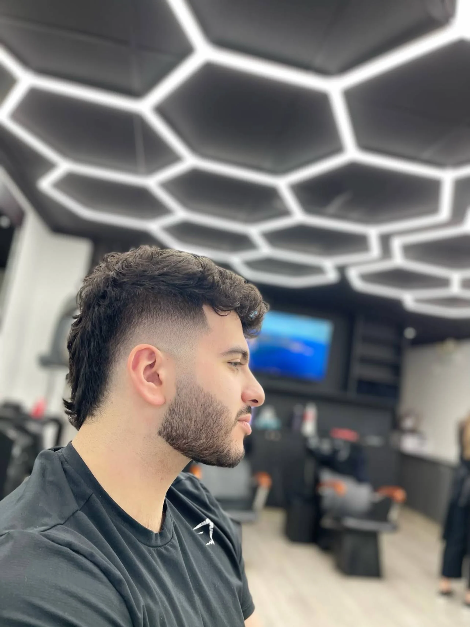 Modern haircut style done by Vancouver barber at Dapper Barber Lounge.